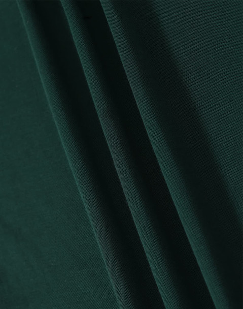 A close-up image of dark green fabric with soft texture, showcasing folds and draping.