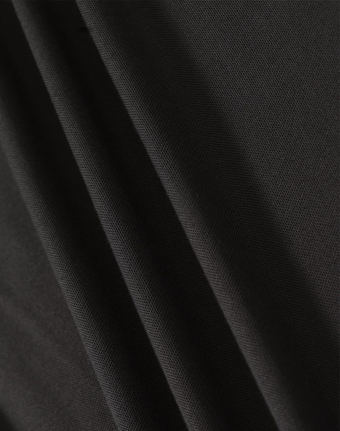 A close-up of black fabric showcasing texture and drape, featuring a subtle weave pattern.
