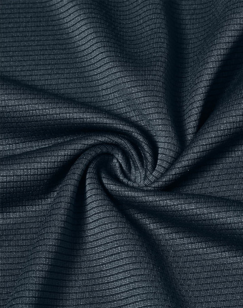 A close-up of navy textured fabric, showcasing a lightweight material with a subtle grid pattern.