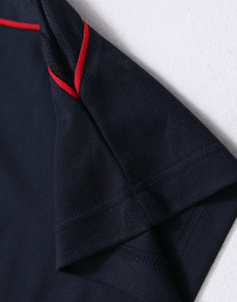 Men's short-sleeve polo shirt in navy blue with red accents. Features a logo on the collar.