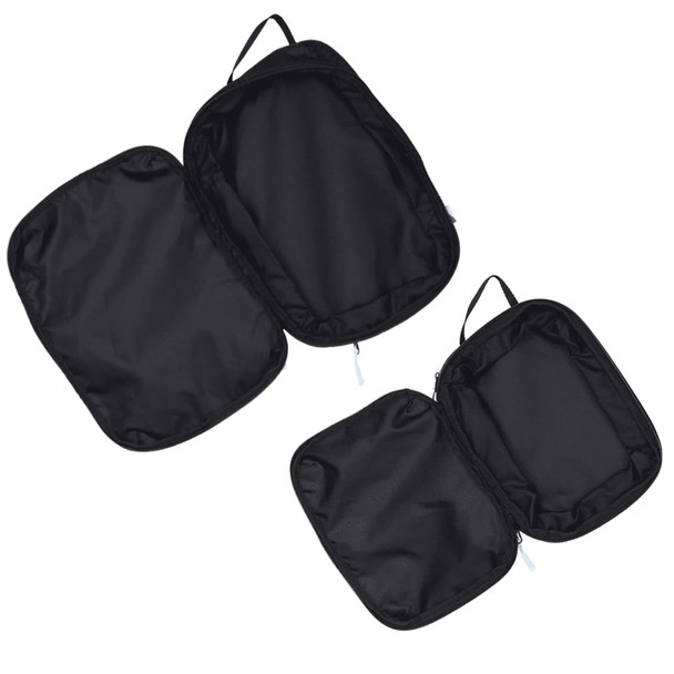 A set of three black compression packing cubes with zippers and handles for easy organisation.