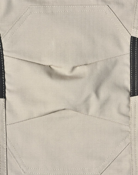 Light grey fabric of work pants featuring detailed stitching and black accents, with a logo present.