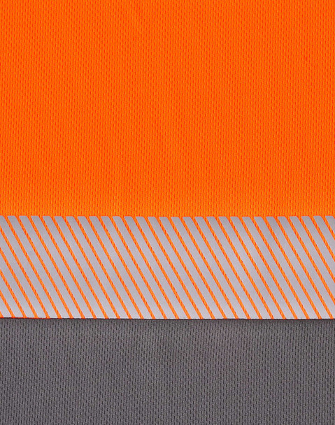 A segmented polo shirt in hi-vis orange and grey with a reflective stripe pattern and a logo.