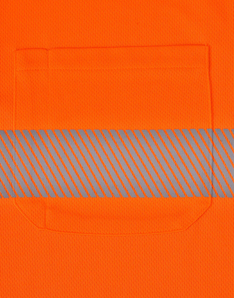 An orange unisex safety polo shirt featuring a grey segmented reflective stripe and a chest pocket.