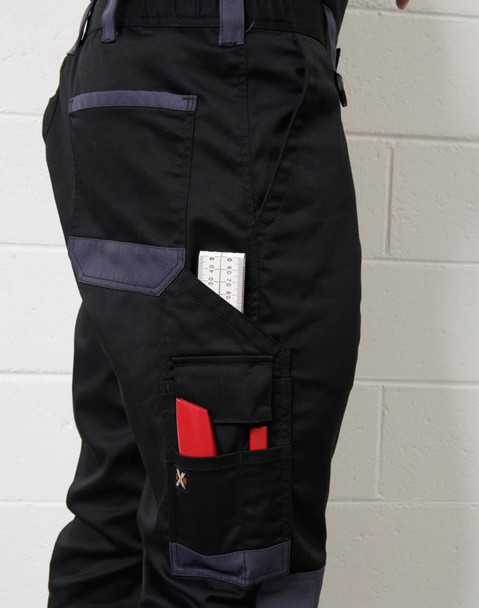 A pair of black unisex utility stretch cargo work pants with multiple pockets, including tool holders and a logo.