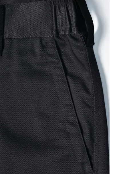 Unisex black utility stretch cargo work pants featuring an elastic waistband and side pockets. Includes branding.