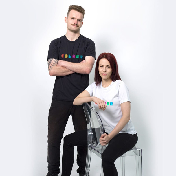 A black men's t-shirt and a white women's t-shirt with a logo are displayed on models against a plain background.