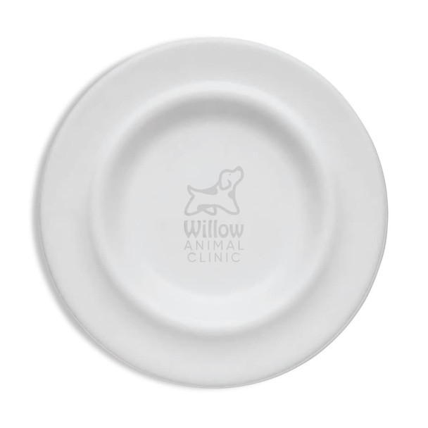 A white pet bowl with a circular design and an embossed logo in the centre.