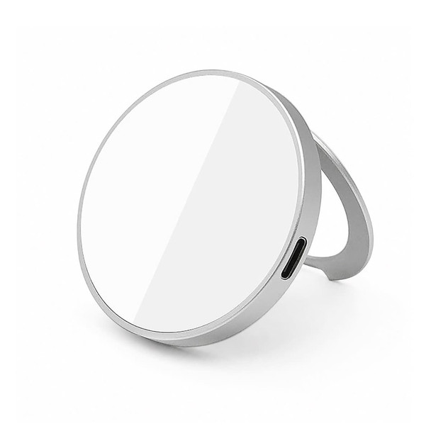 A magnetic phone and watch charger with a silver stand, featuring a circular design and a smooth white surface.