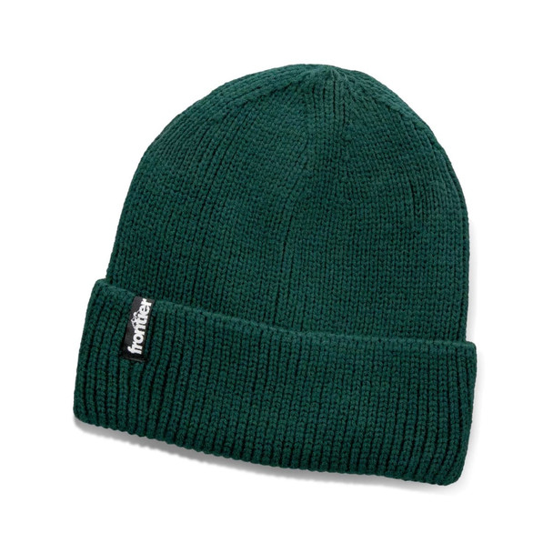 A green knitted beanie with a folded cuff and a logo tag.