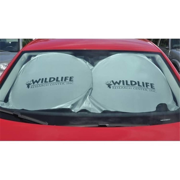 A foldable car shade in light grey, featuring a logo, placed inside the windshield of a red car.