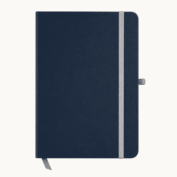 A navy blue A5 notebook with a grey elastic band and a ribbon bookmark. It features a logo on the cover.