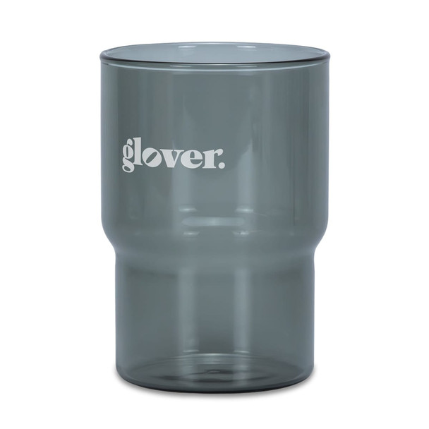A drink tumbler in a smoky grey colour with a logo. Features a modern design suitable for various beverages.