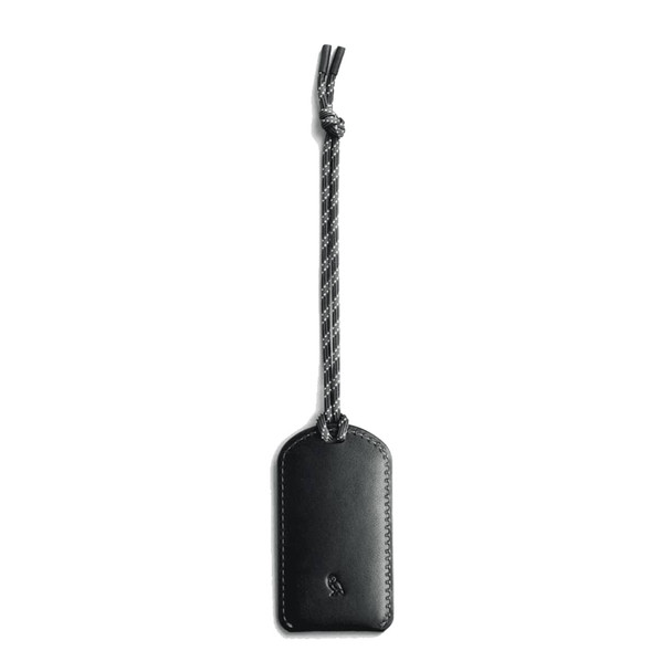 A black luggage tag made of leather, featuring a braided attachment. It has a logo on its surface.