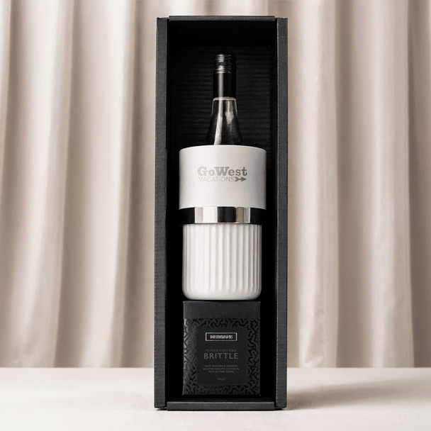 A wine bottle with a white and black cooler, placed in a stylish black and white gift box.