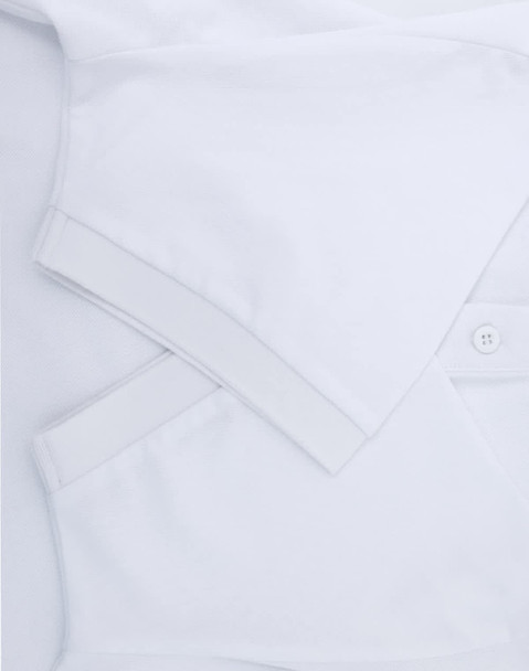 A white men's ultrafine cotton pique polo shirt featuring a collar and button placket, with a logo present.