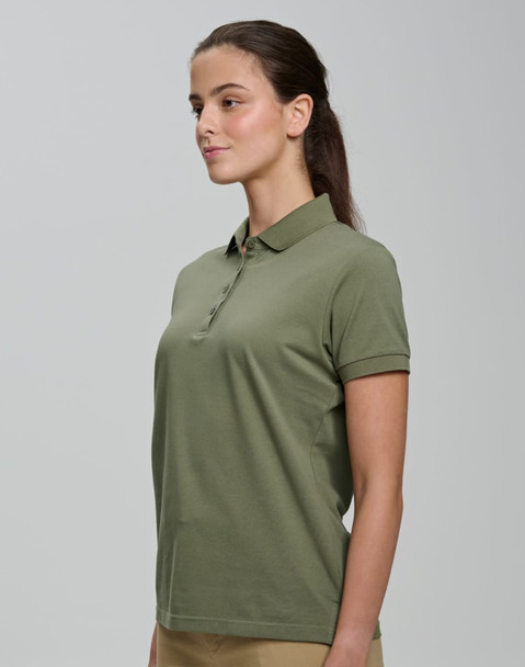 A woman wearing an olive green ultrafine cotton pique polo with a classic collar and short sleeves.
