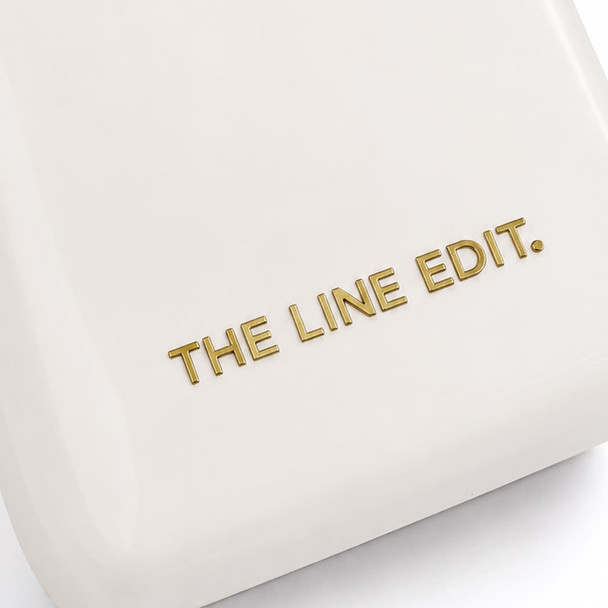 A cream cooler featuring a simple, sleek design with a gold logo.