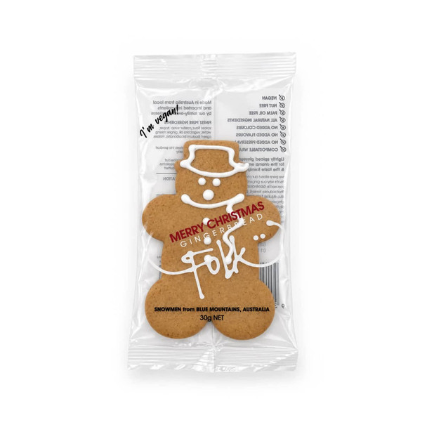 A gingerbread man cookie in a clear wrapper, featuring white icing decorations and a festive 'Merry Christmas' message.
