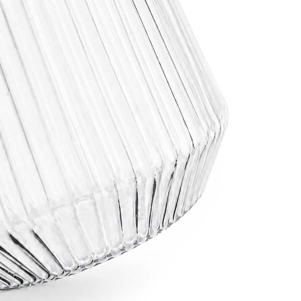 A clear glass tumbler with a ribbed design, featuring a tapered shape and a smooth finish.