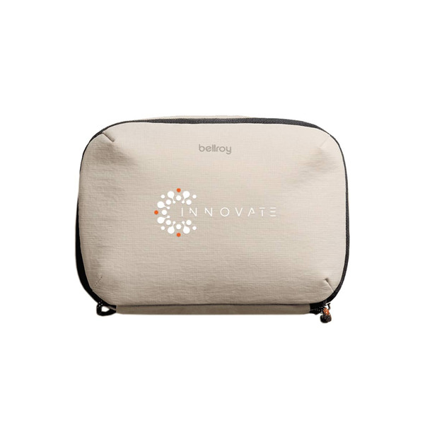 A light beige tech kit with a zip closure and a logo on the front. Ideal for organising small technology items.