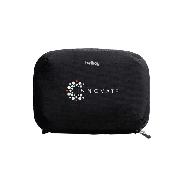 A black tech kit with a zip closure, featuring a logo on the front and a sleek design.