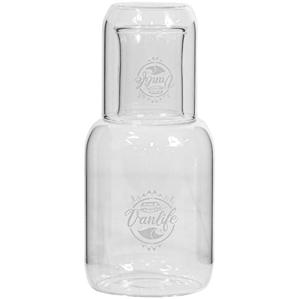 A glass carafe and cup set, featuring clear glass with a smooth design and a branded logo.
