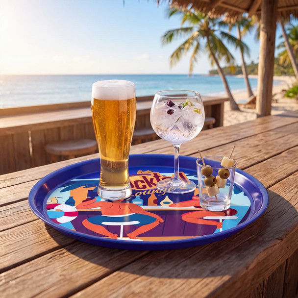A vibrant purple serving tray featuring a cocktail, a beer, and appetisers on a beachside table.