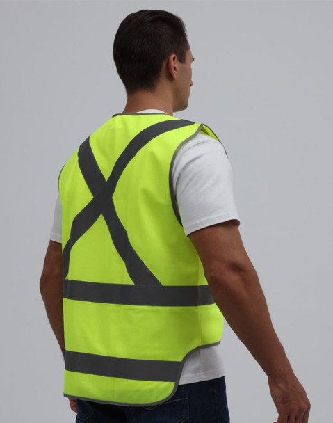 A high-visibility yellow safety vest with reflective stripes and a tail, worn by a model from the back.