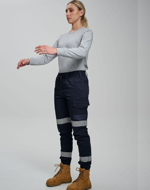 Cotton stretch drill cuffed work pants in navy blue with reflective tape, featuring pockets and a casual top.