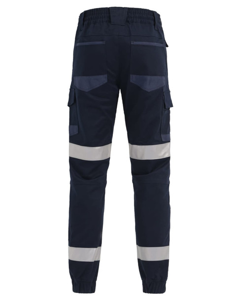Cuffed work pants in navy with reflective tape and multiple pockets. Features an elastic waistband at the back.