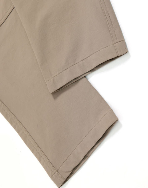 DWR water repellent flexi work pants in a light taupe colour with stitched hem details. Features a logo.