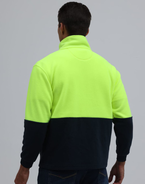 A full zip jacket featuring a high-visibility yellow upper and navy lower section, with a folded collar and branding.