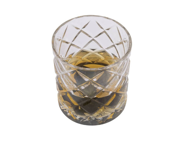 A crystal tumbler with a whisky drink inside, featuring a diamond-cut design and clear glass.
