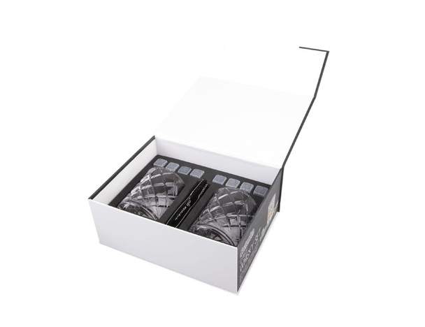 A whisky set with two crystal tumblers and whisky stones, presented in a sleek black and white box.