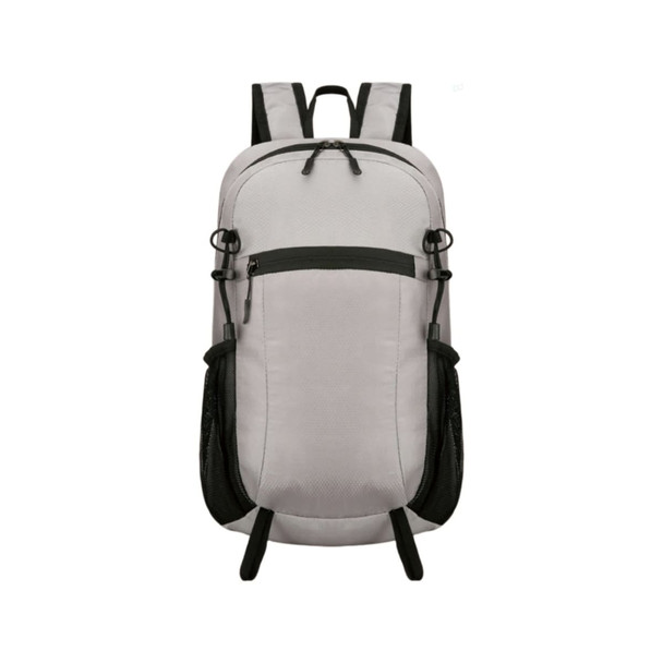 A light grey packable hiking backpack with black accents and mesh side pockets. It features adjustable straps and a zippered front pocket.