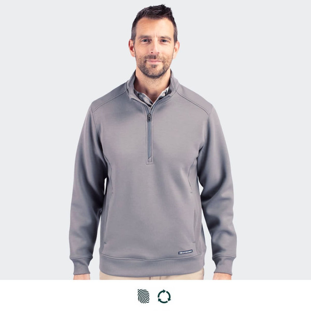 A man wearing a grey Cutter & Buck Roam men's half zip jacket, featuring a collar and a logo on the chest.