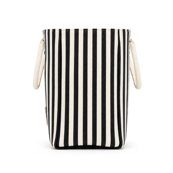 A striped tote bag in black and cream with two handles and a logo on the side.