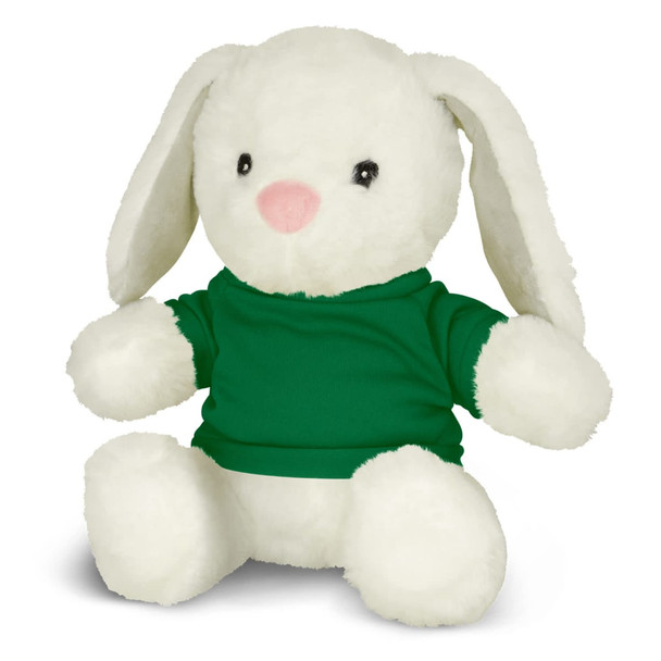 A white plush rabbit with long ears, wearing a green shirt. The toy is seated and has black eyes and a pink nose.