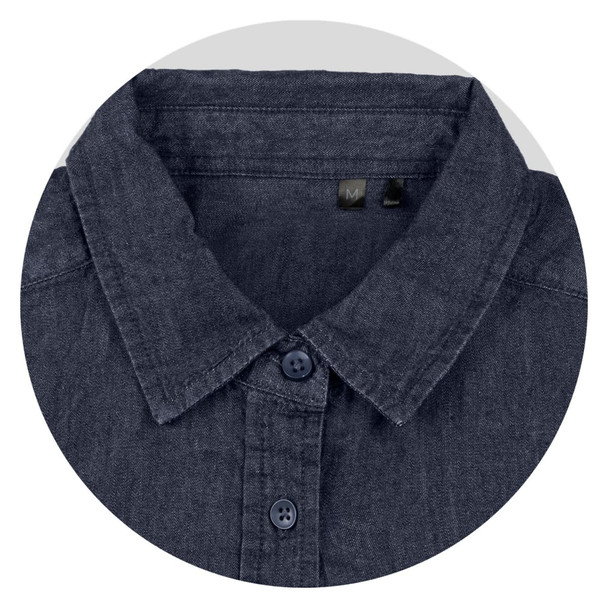 A close-up of a dark denim button-up shirt with a collar and navy buttons. The shirt has a logo tag inside. A close-up of a dark denim button-up shirt with a collar and navy buttons. The shirt has a logo tag inside.