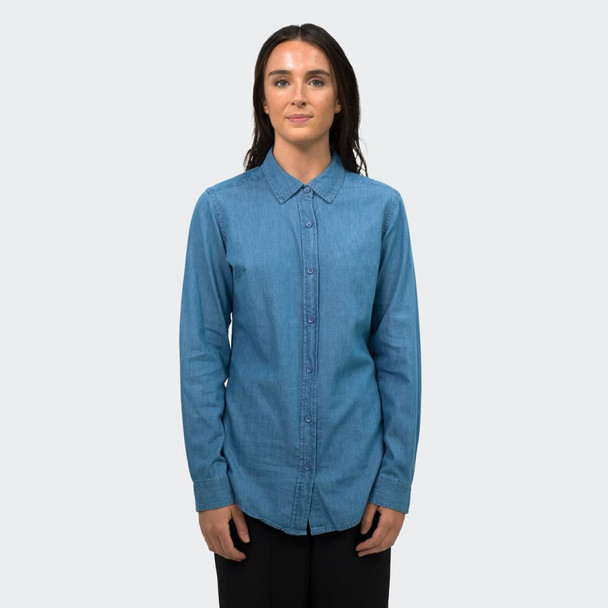 A women's button-up denim shirt in a light blue shade, featuring long sleeves and a collared neckline.