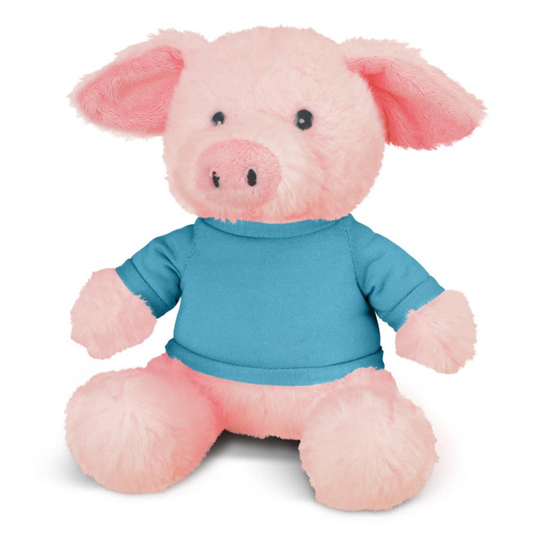 A pink pig plush toy wearing a blue shirt, featuring soft fur and rounded features. It has a logo on the shirt.