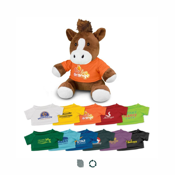 A plush horse toy wearing an orange shirt, surrounded by various smaller T-shirts in different colours.