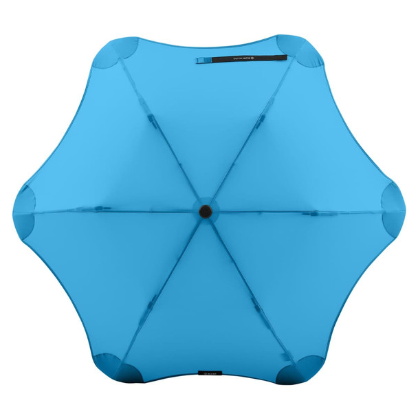 A blue BLUNT Metro Umbrella featuring a unique, aerodynamic design and a central black button.