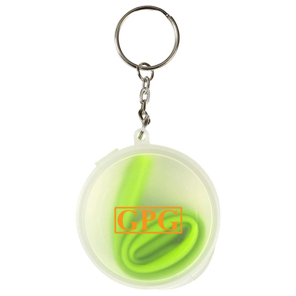 A green reusable silicone straw coiled inside a clear round case with a keychain attachment.