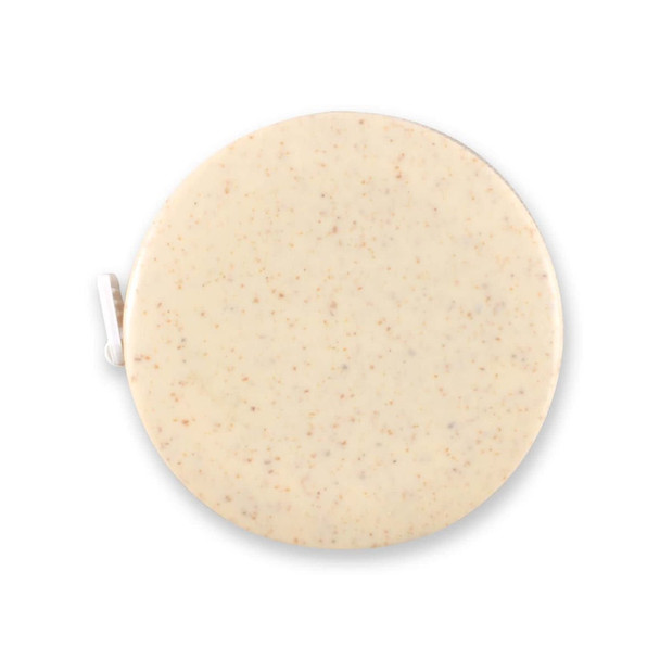 A round Tornado Wheat Fibre Tape Measure with a smooth surface and a muted color.