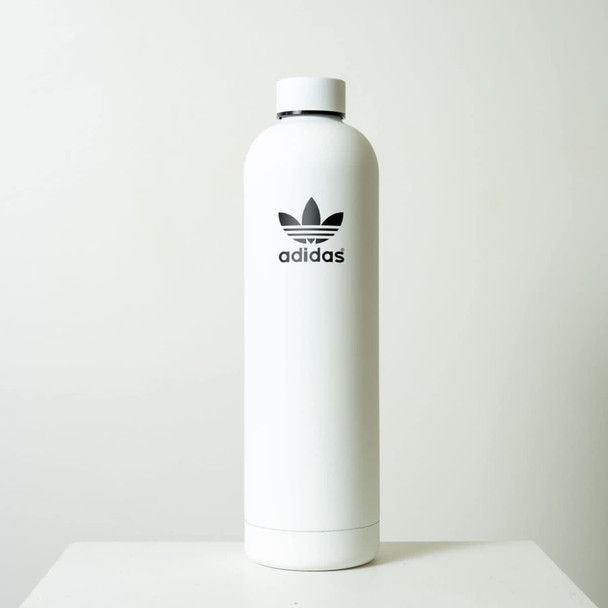 A drink bottle in a sleek white design with a black logo. It features a smooth, cylindrical shape.
