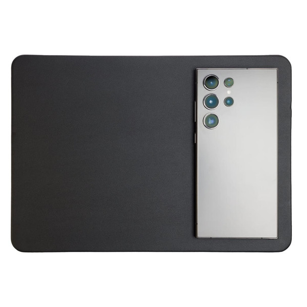 A wireless charger and mouse pad combination featuring a sleek black design, with a smartphone positioned on top.