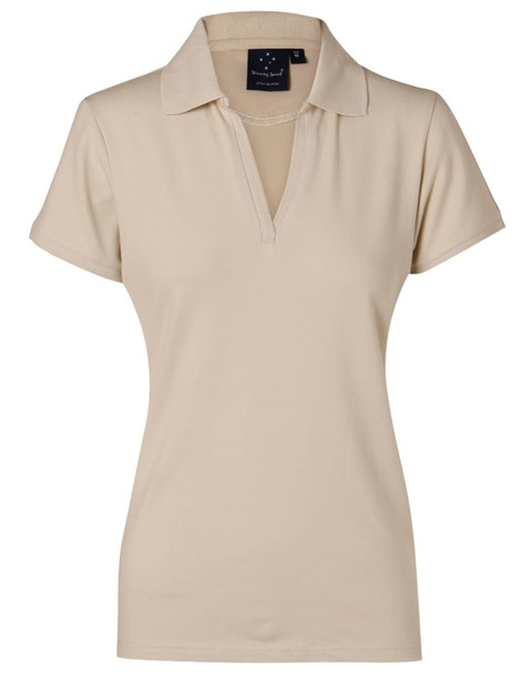 A beige ladies' polo shirt featuring a collar and a logo. Ideal for casual or sporty wear.