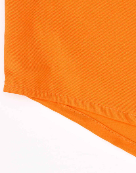 An orange closed front long-sleeve shirt with perforated tape detail and a branding logo.